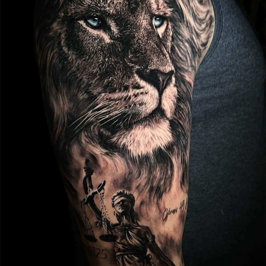Black and grey tattoo of lion and woman holding scales with Emall Eliot Cartridge Needles