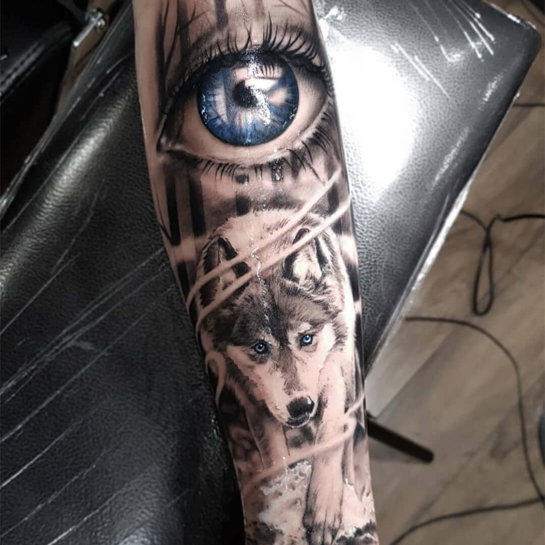 Animal tattoo of a wolf with blue eyes with Emalla Eliot Cartridge Needles