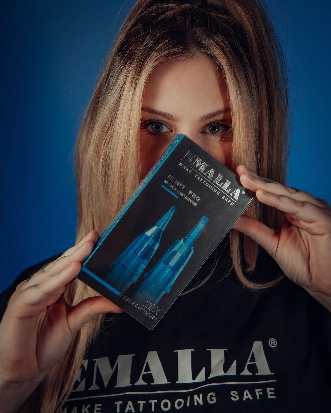 Emalla Pro team artist posing with Emalla cartridges.