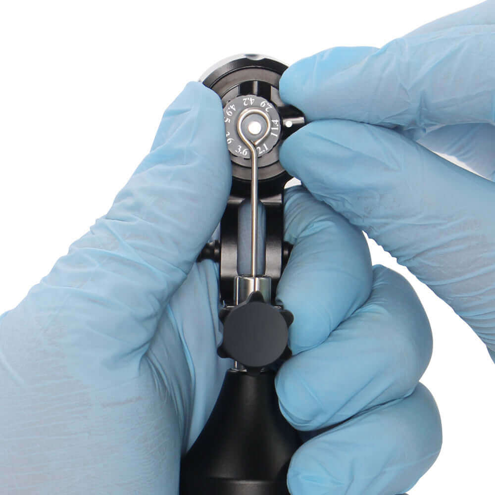 EMALLA PRODX Rotary Tattoo Machine Black being used from vertical view