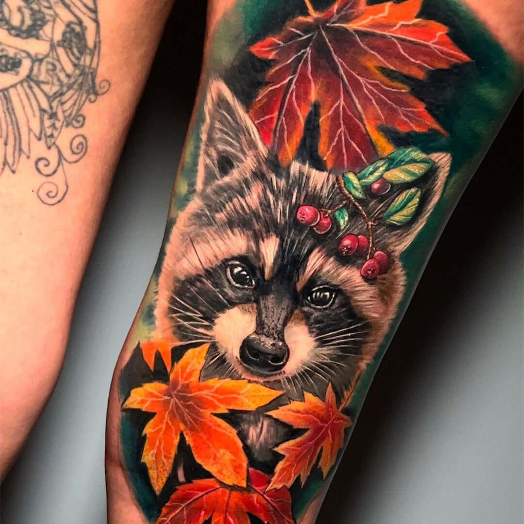 Cute raccoon realism tattoo with maple leaves by Emalla Eliot Cartridge Needles