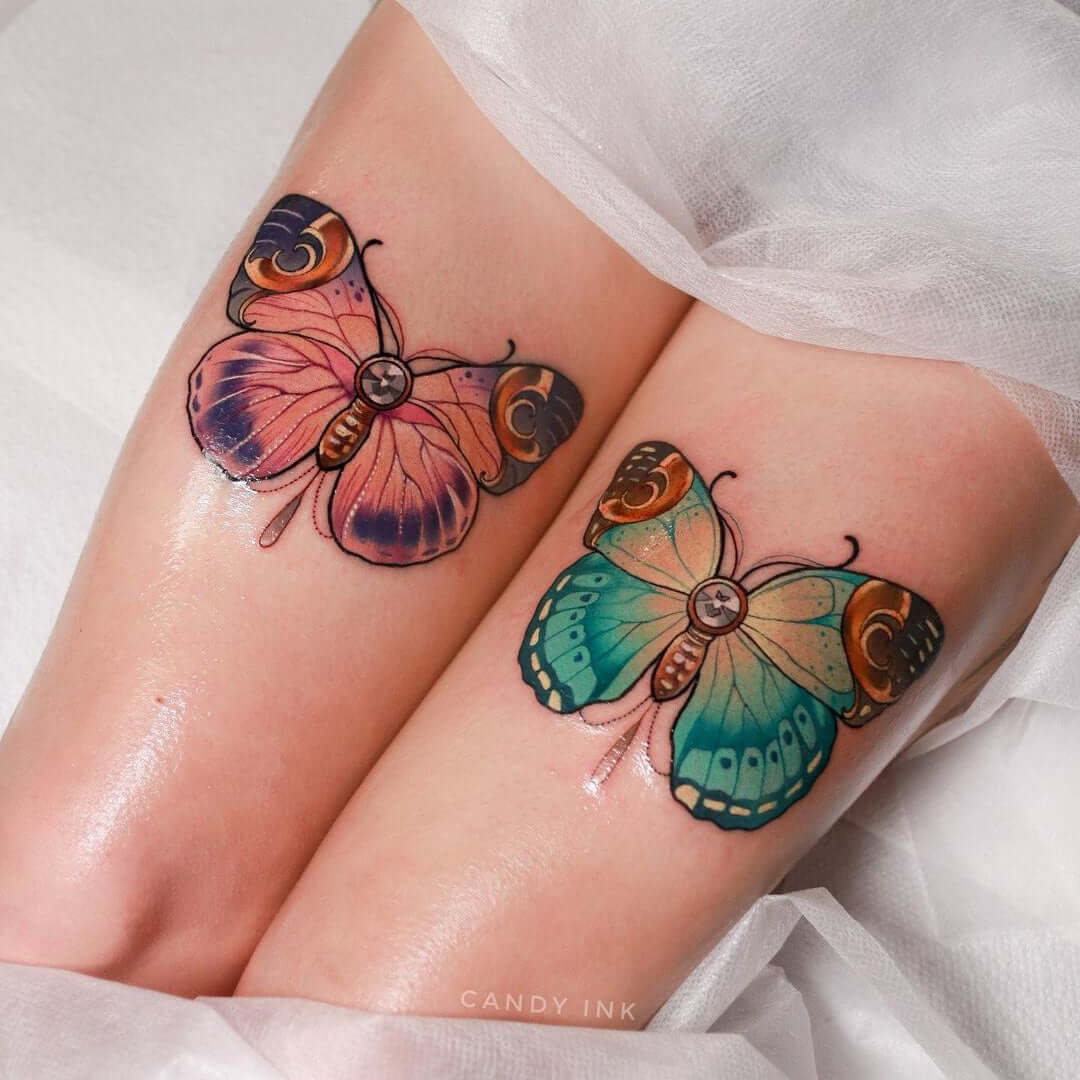 Purple and pink, green and yellow butterflies tattooed on legs with Emalla Eliot Cartridge Needles