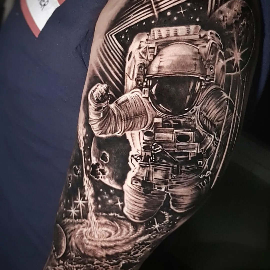 Black and gray tattoo artwork of astronaut in space with Emalla Eliot Cartridge Needles